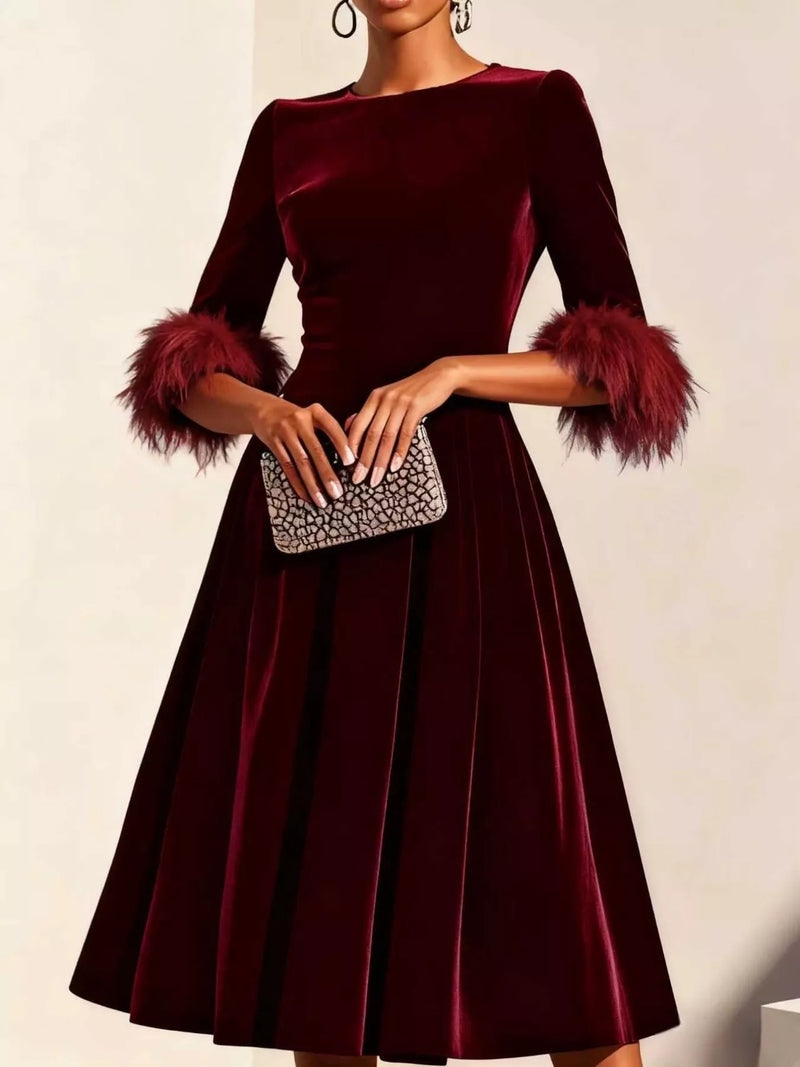 Burgundy velvet midi dress with feather cuffs from the Postcards from Europe edit