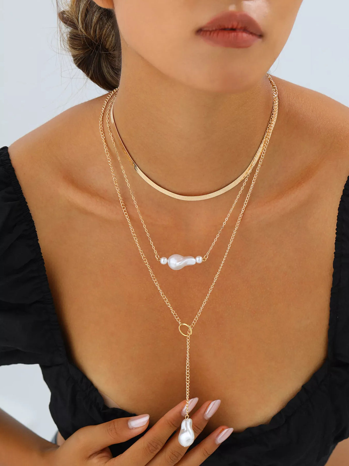 Perla Three-Layer Pearl Necklace in Gold, worn on model