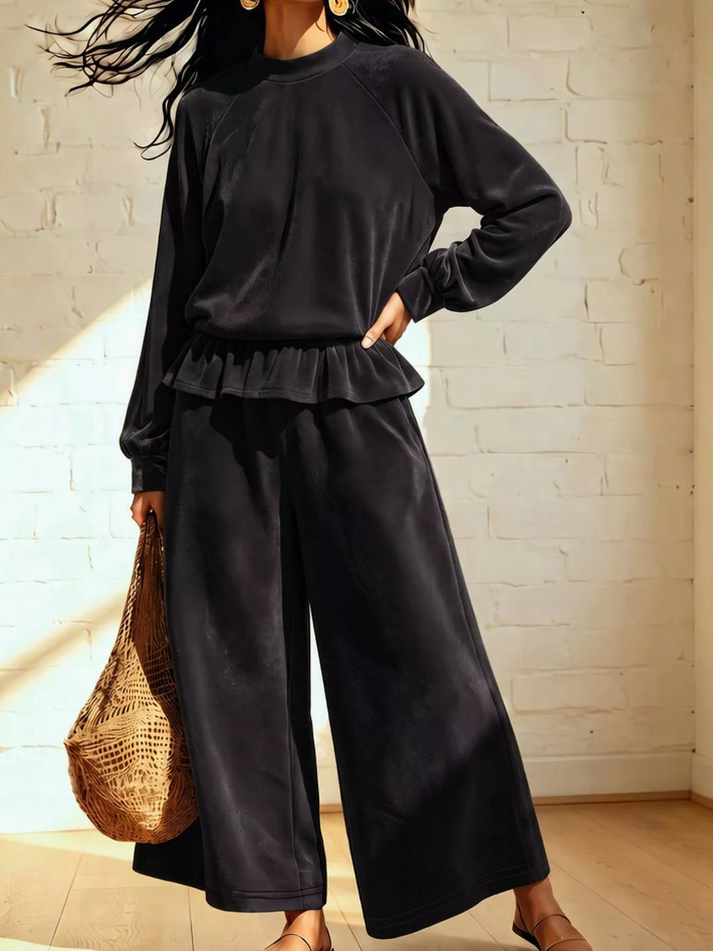 Theodora Velvet Peplum Top + Wide-Leg Pant Set in Black, on model