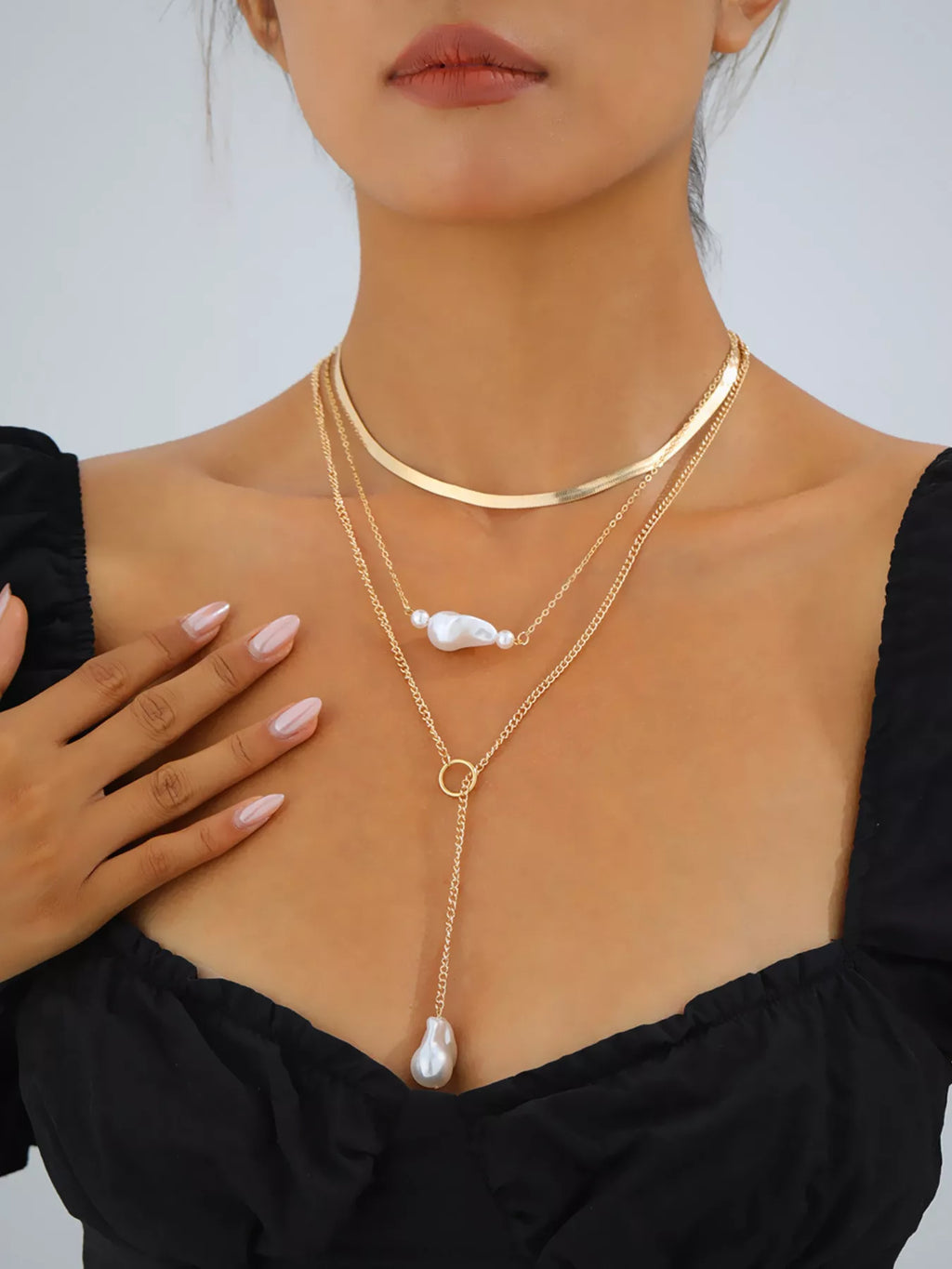 Perla Three-Layer Pearl Necklace in Gold, worn on model