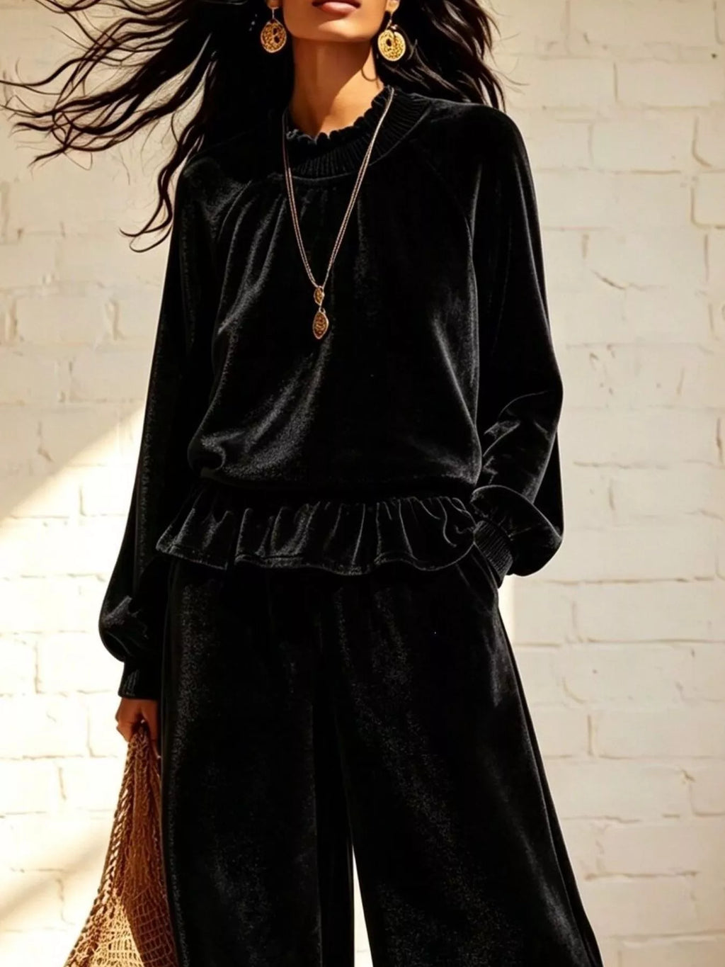 Theodora Velvet Peplum Top + Wide-Leg Pant Set in Black, on model
