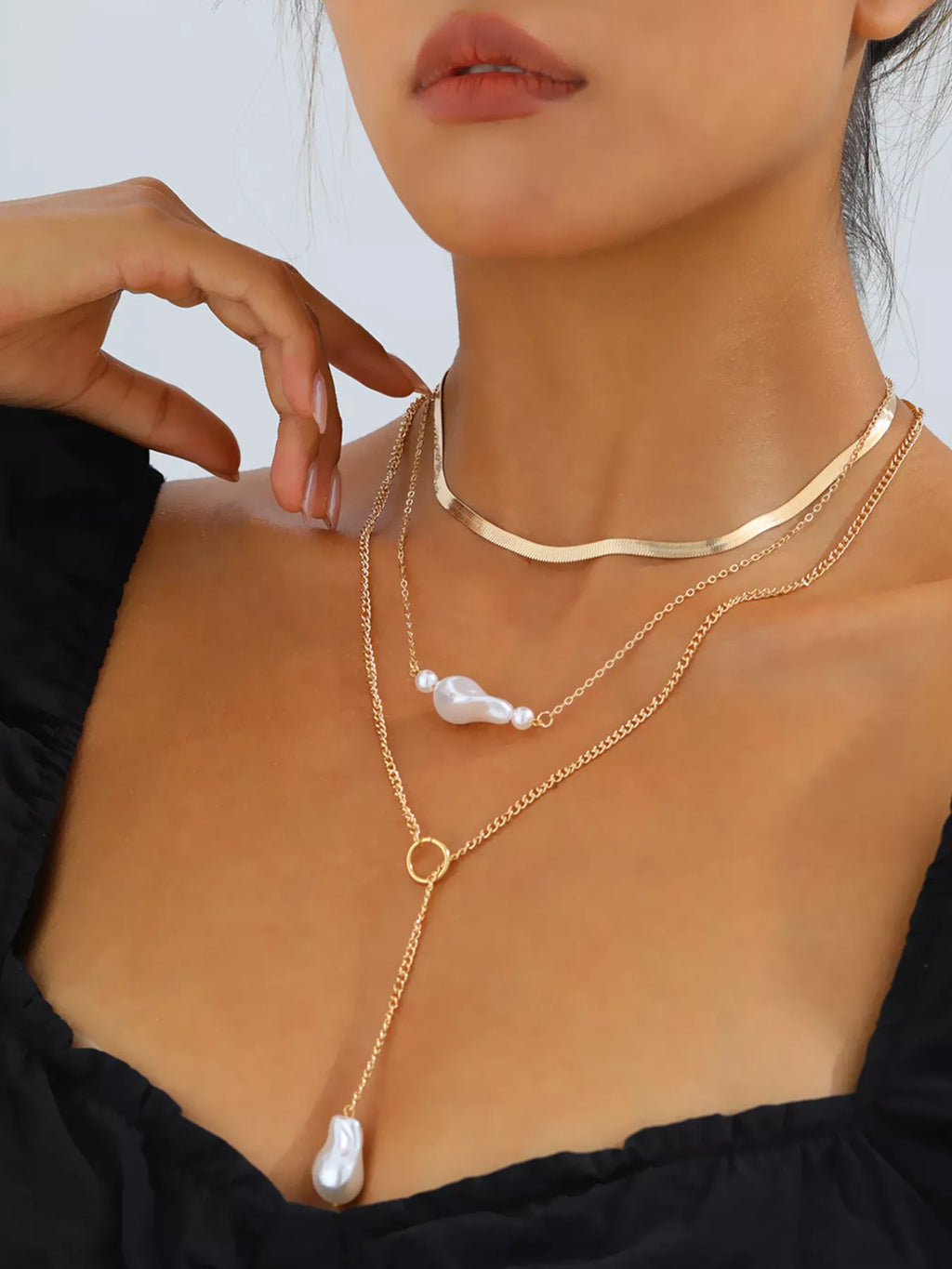 Perla Three-Layer Pearl Necklace in Gold, worn on model