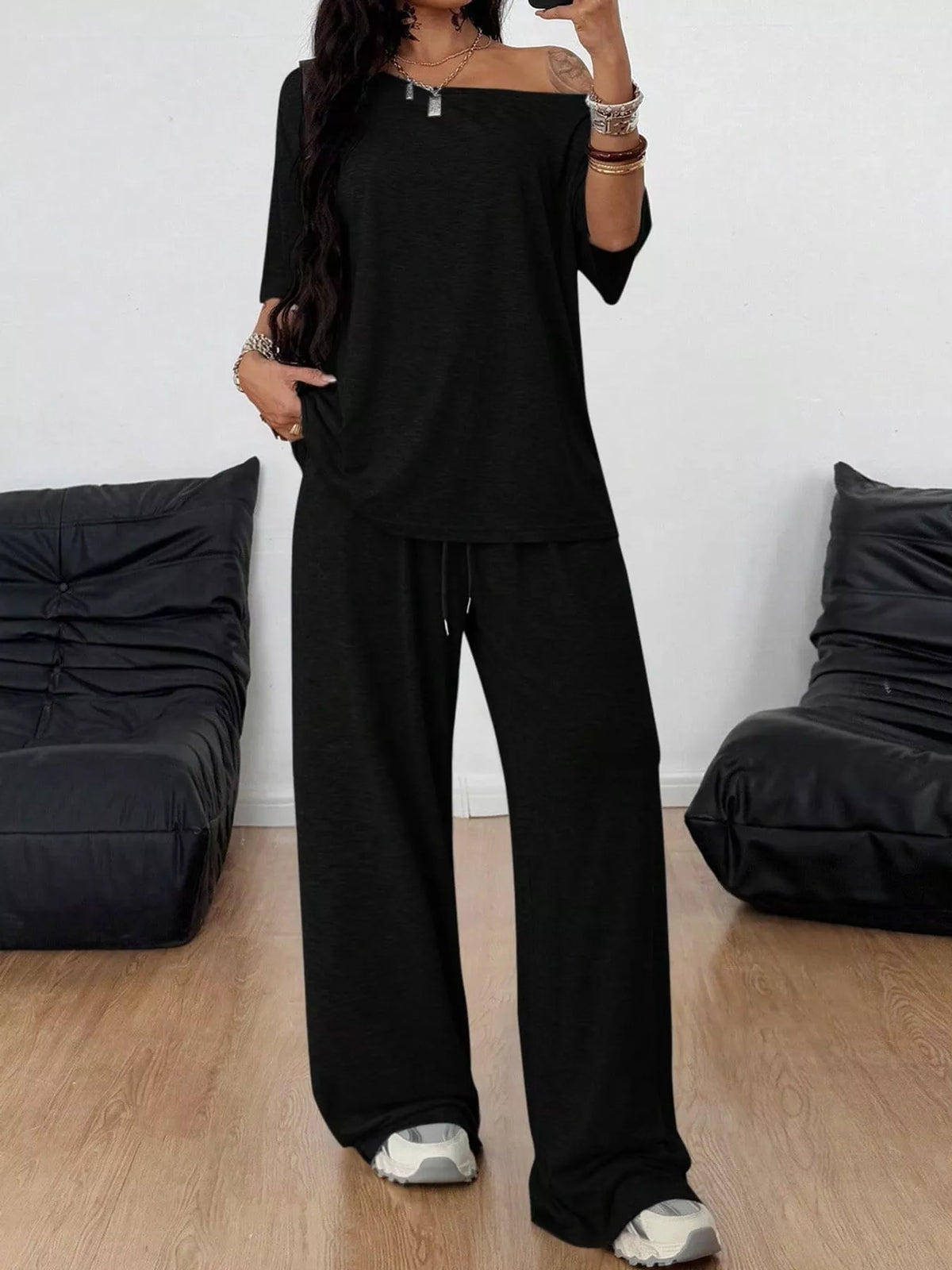 Linnea Off-Shoulder Top + Wide-Leg Pants Set in Black, on model