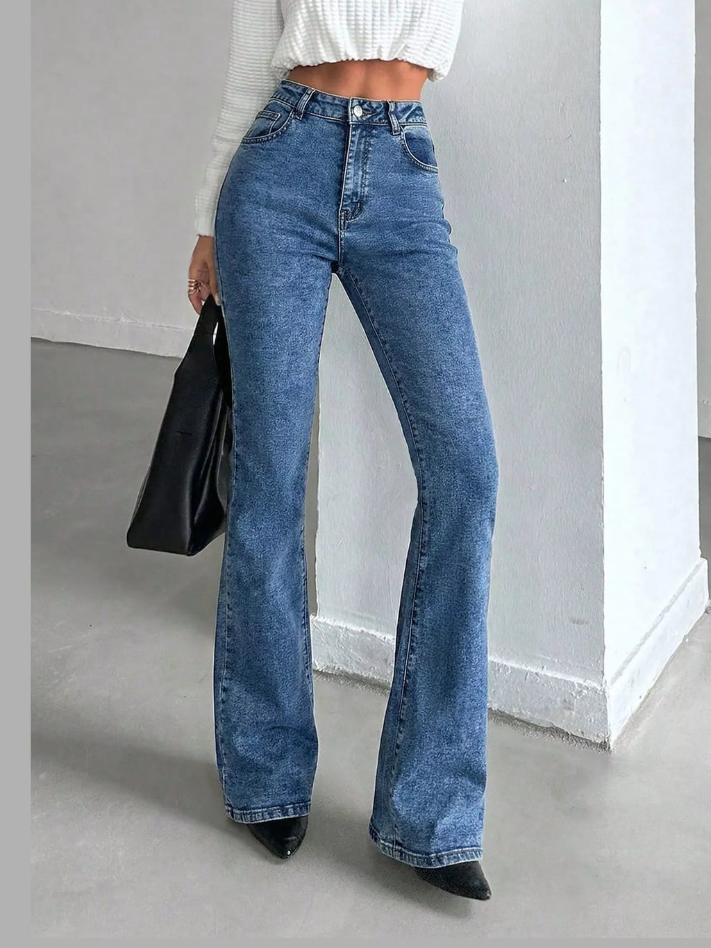 Vera High-Waisted Slim Flare Jeans in Light Blue, on model
