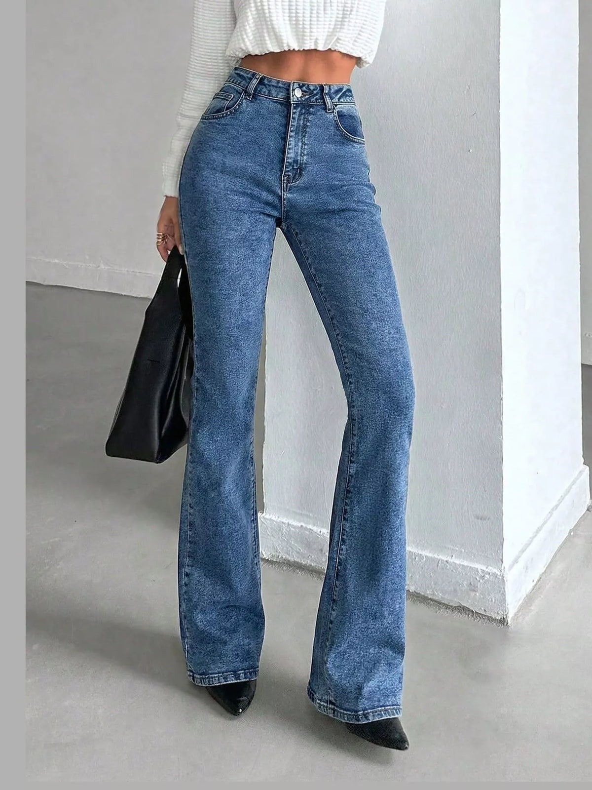 Vera High-Waisted Slim Flare Jeans in Light Blue, on model