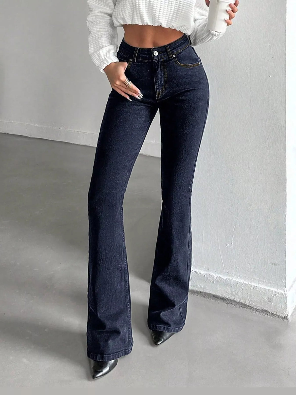 Vera High-Waisted Slim Flare Jeans in Black, on model