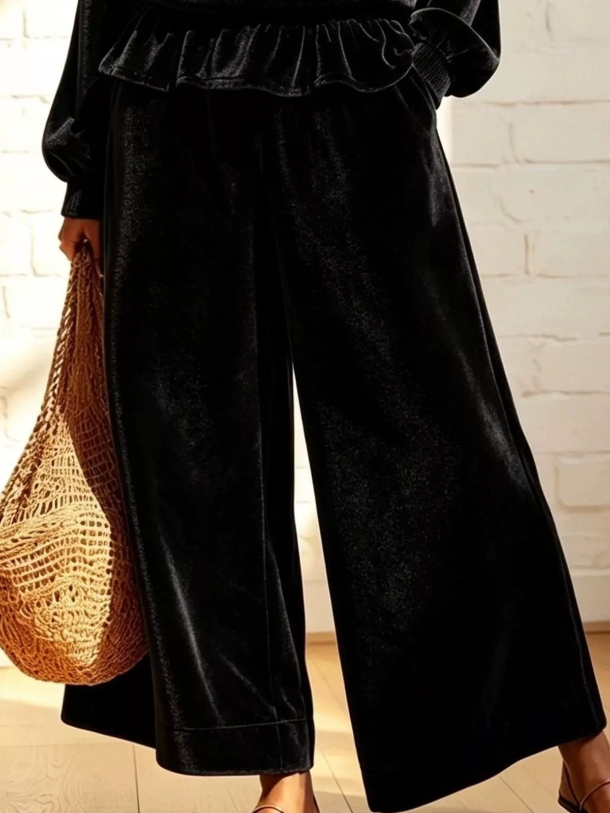 Theodora Velvet Peplum Top + Wide-Leg Pant Set in Black, on model