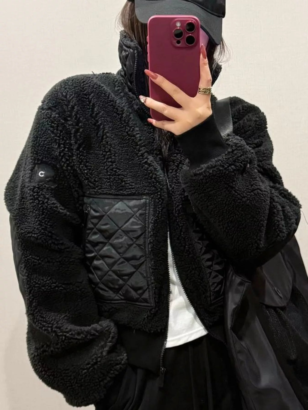 Kiki Sherpa Quilted Zip-Up Jacket in Black, on model