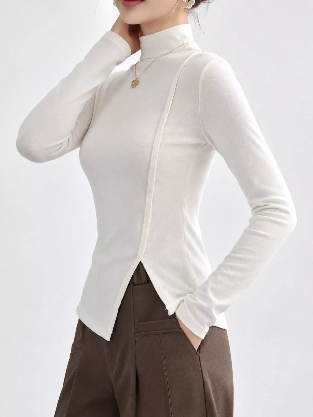 Una Asymmetric Mock-Neck Long-Sleeve Top in White, on model