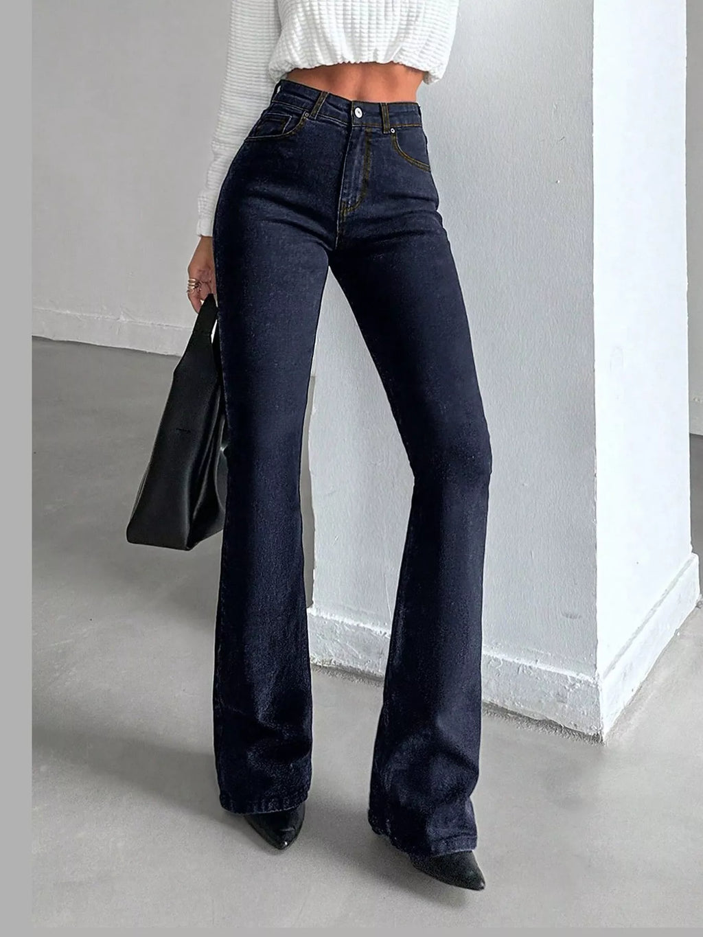 Vera High-Waisted Slim Flare Jeans in Black, on model