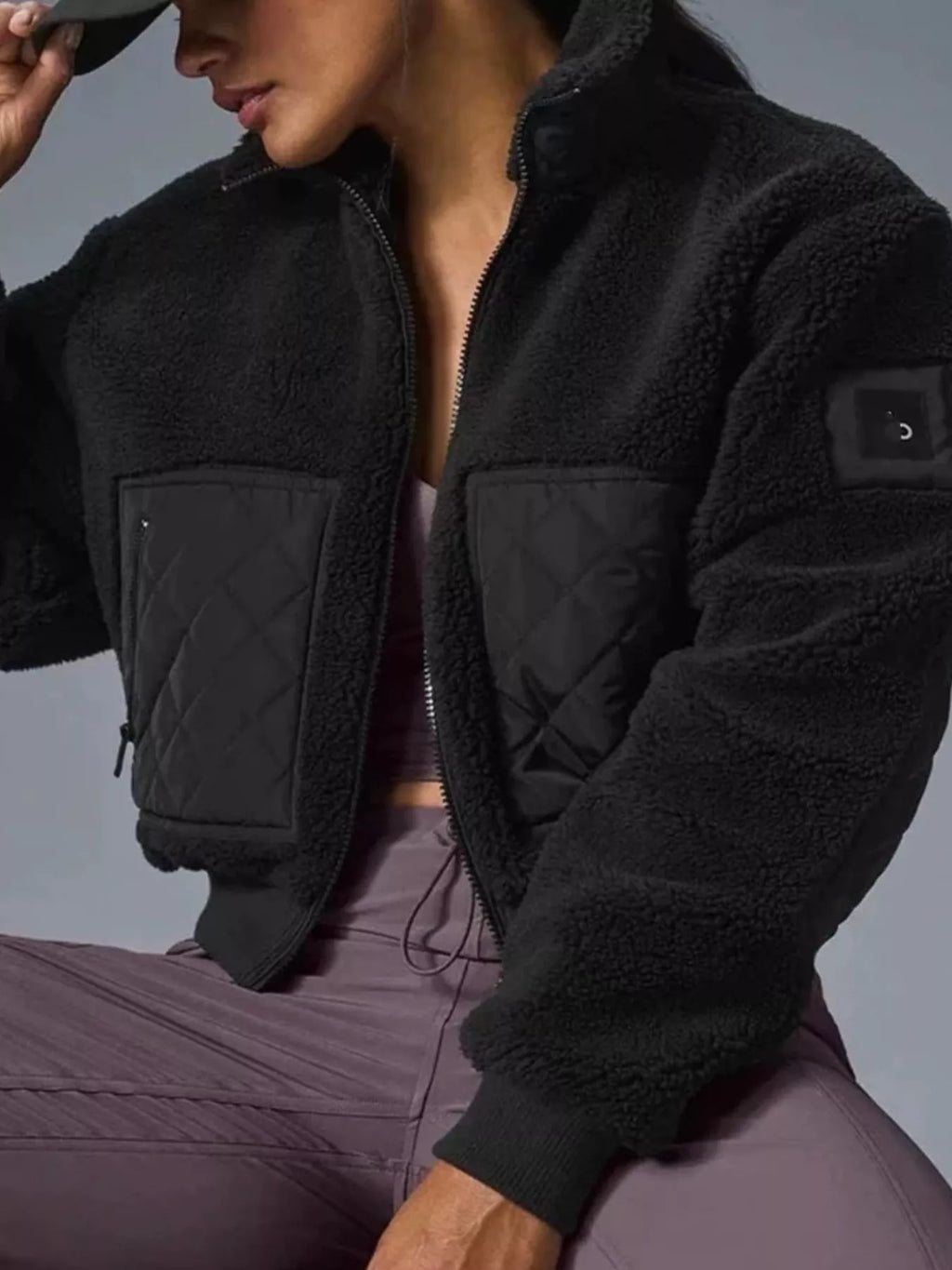 Kiki Sherpa Quilted Zip-Up Jacket in Black, on model