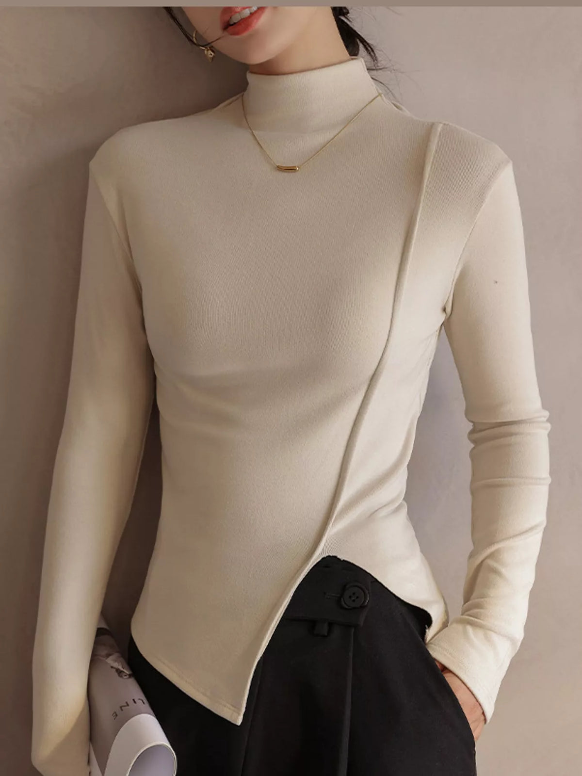 Una Asymmetric Mock-Neck Long-Sleeve Top in Beige Apricot, on model