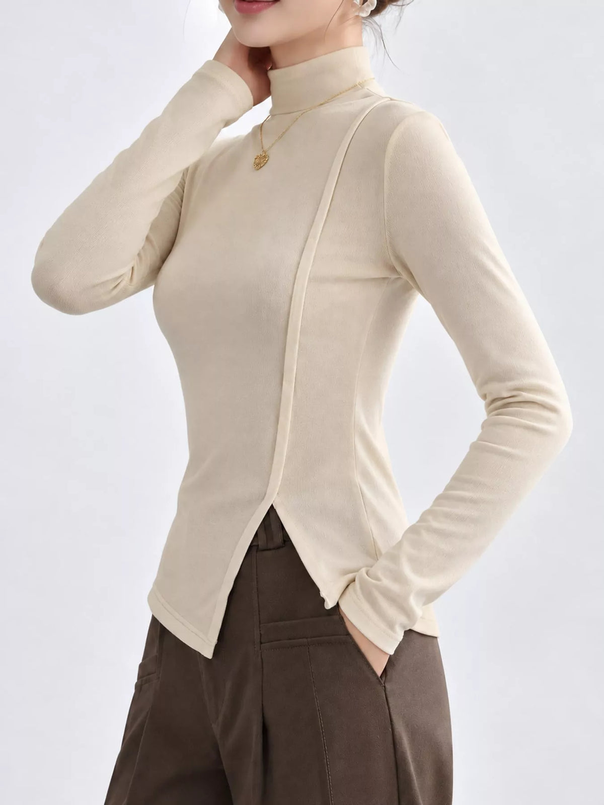Una Asymmetric Mock-Neck Long-Sleeve Top in Beige Apricot, on model