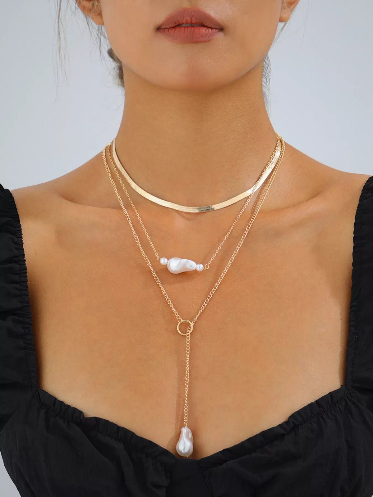 Perla Three-Layer Pearl Necklace in Gold, worn on model