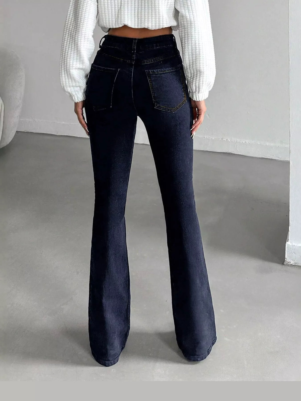 Vera High-Waisted Slim Flare Jeans in Black, on model