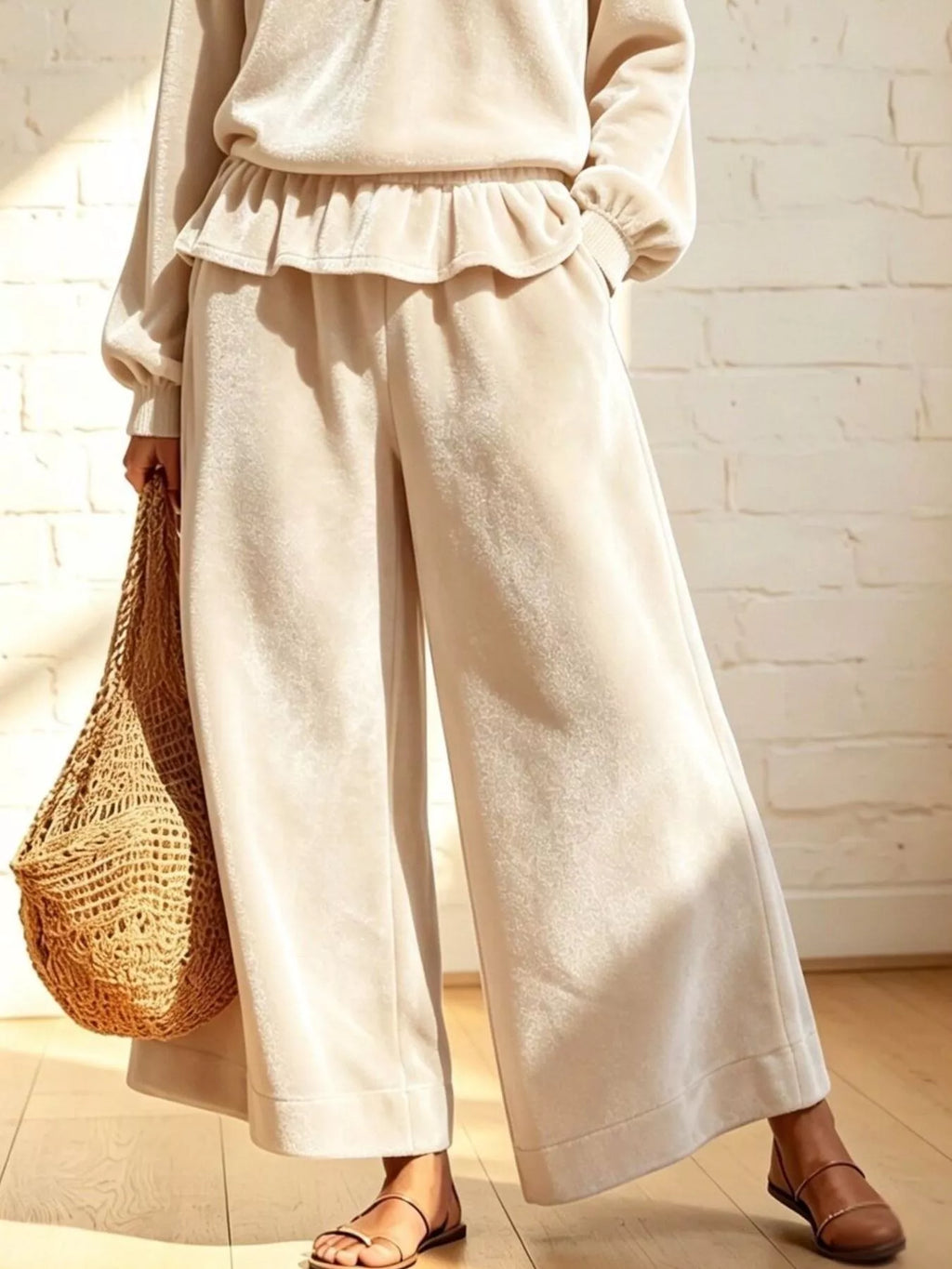 Theodora Velvet Peplum Top + Wide-Leg Pant Set in Beige, on model