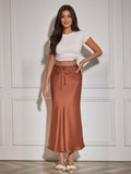 Jacqueline cognac satin midi skirt with drawstring waist, on model, front view